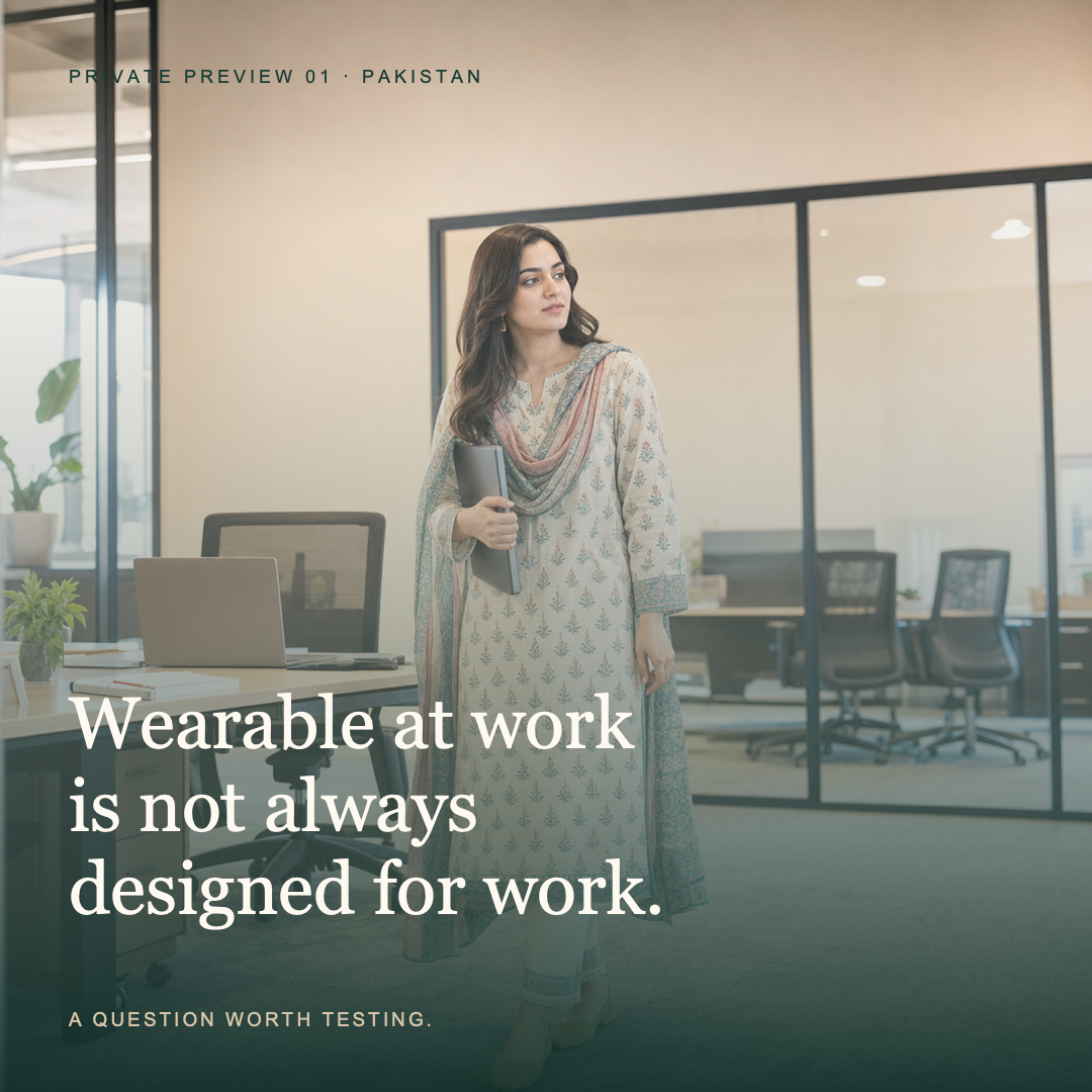 A Pakistani professional wearing everyday printed clothing in a contemporary office
